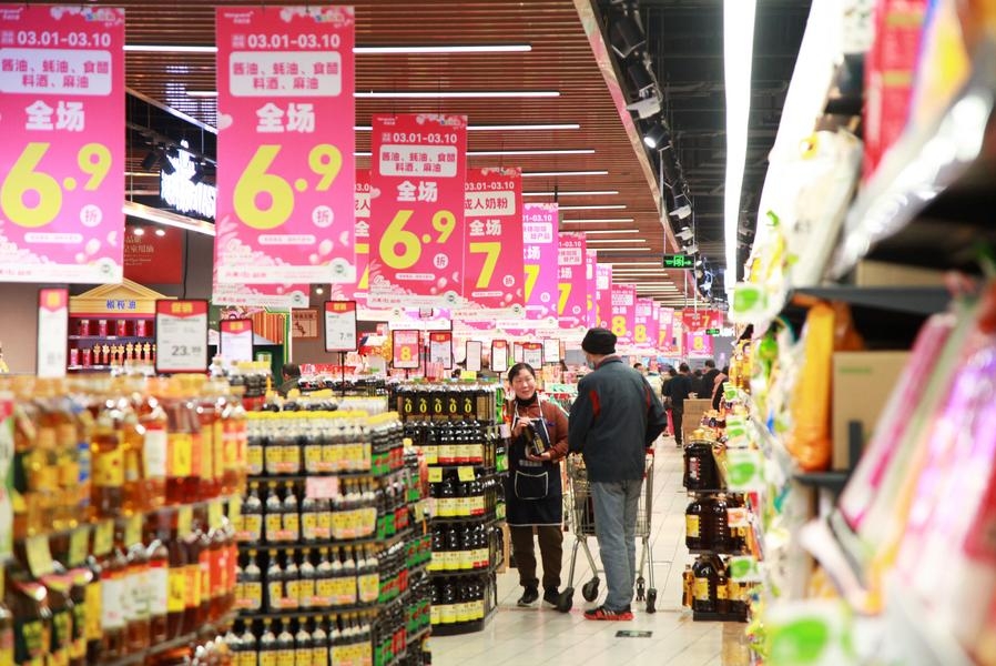 A customer shops at a supermarket in Nanjing, east China